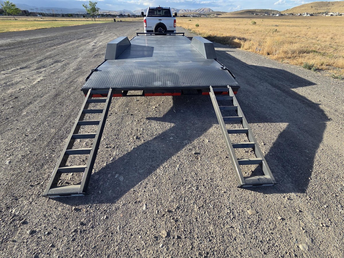 Car hauler with slide-out steel loading ramps deployed