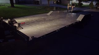 Car hauler LED deck lights lit at night