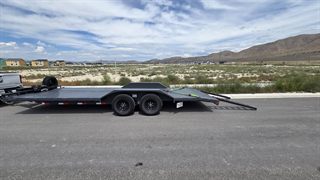 Car hauler side view with slide-out ramps down