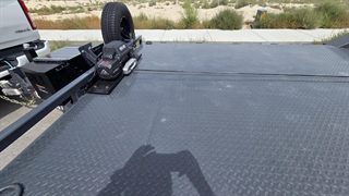 Car hauler deck with winch, solar charger and spare tire