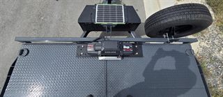 Badland Apex 12,000 lb winch with wireless remote mounted on the car hauler