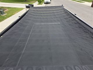Dump trailer with mesh tarp cover