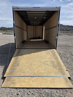 Enclosed trailer rear ramp door open