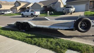 2025 RawMaxx Stealth X 22ft equipment trailer, side profile with ramps stowed
